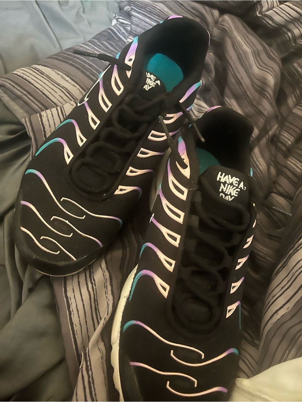 Nike Men’s Black Athletic Shoes with Iridescent Purple and Teal Accents